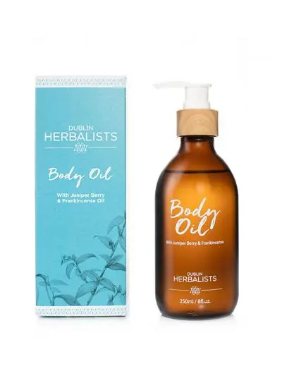 White background cut-out shot of Dublin Herbalists body oil with packaging.
